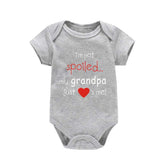Unisex baby romper laid flat showing full design and stitching
