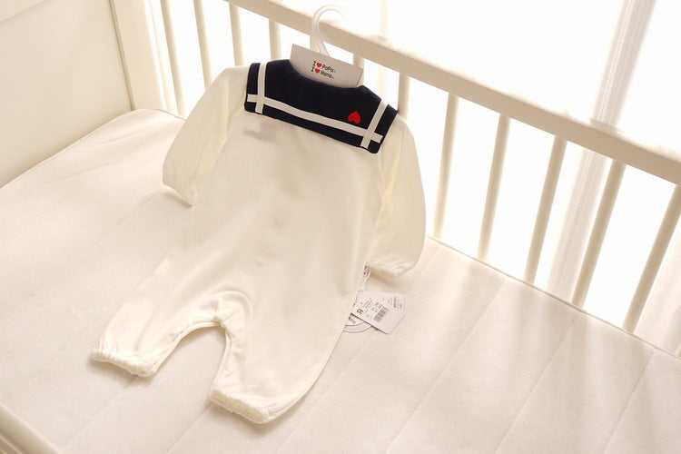 Newborn baby wearing Navy Style Baby Onesie soft cotton fabric
